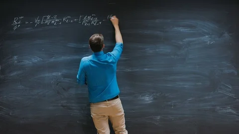 Time-Lapse of the  Mathematician Writes Complex Equation on the Blackboard. Stock Footage