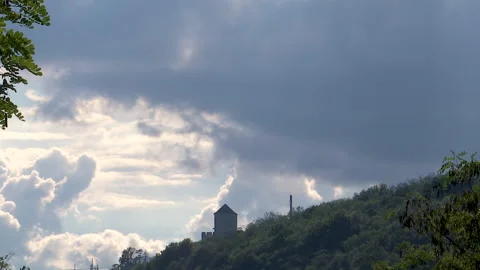 Time lapse of a medieval tower on top of a hill with clouds passing by Видео 212428209
