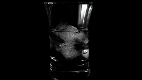Time lapse of melting ice cubes in glass Stock Footage 130037622