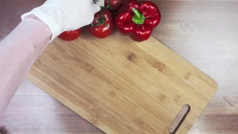 Time lapse. Men hands lay out vegetables on wooden background. Stock Footage 83997353