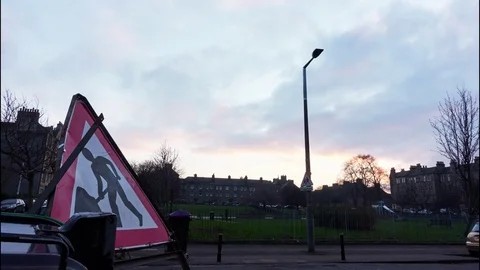 Time Lapse of Men at Work sign in Edinburgh, Scotland Stock Footage 77373392