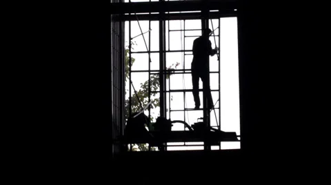 Time lapse of men working on a large window Stock Footage 33064060
