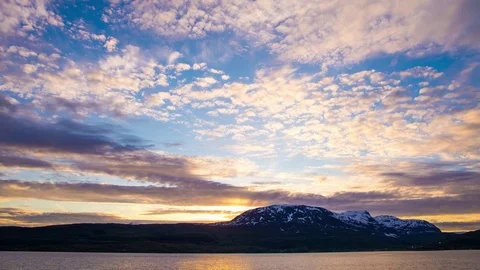 Time lapse of midnight sun behind mountain in northern Norway Stock Footage 75012727