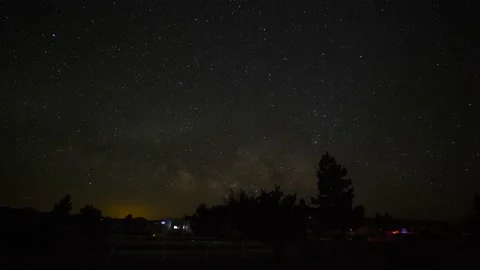 Time lapse of the Milky Way galaxy rising above a campground Stock Footage 131155233