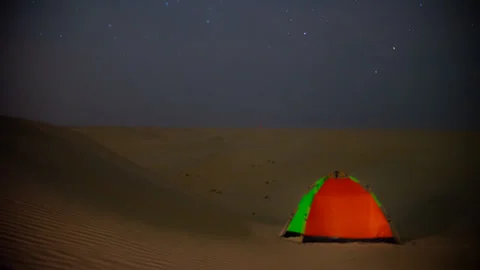 Time lapse milky way motion across night sky during off road camping in desert Stock Footage 269813177
