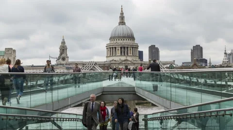 Time lapse of Millennium Bridge and St. Paul's Cathedral, Commuters and Tourists Stock Footage 48014477