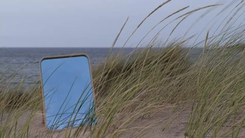 Time lapse of mirror on sandy windy beach Stock Footage 130278409