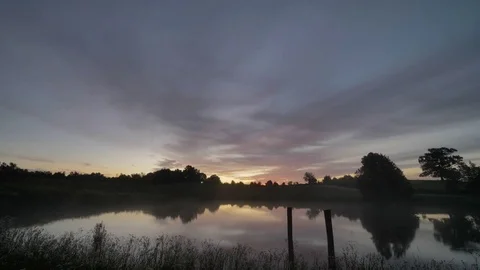 Time Lapse Mist Rising on Reflective Morning Waters Stock-Footage 78019411