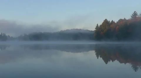 TIME LAPSE - Mist Rolling over Lake in Morning Stock Footage 33464801