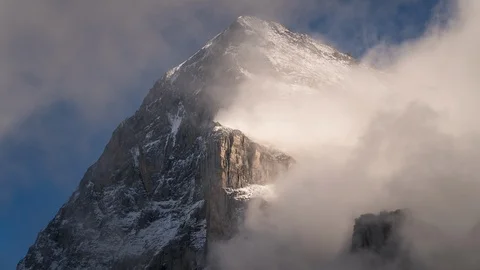 Time lapse of misty clouds over the Eiger North Face in Switzerland Stock Footage 123944218