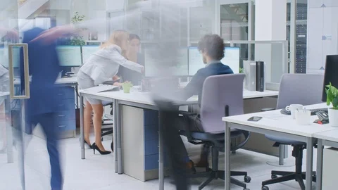 Time-Lapse In the Modern Open Space Office Businessmen and Businesswomen Working Stock Footage 106775833