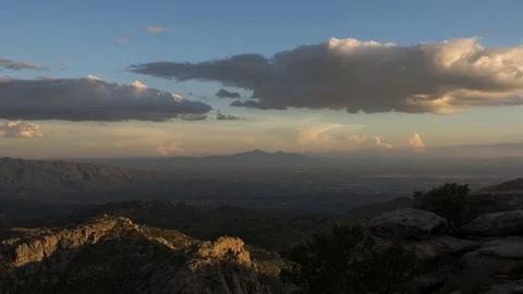 Time lapse of monsoon clouds and distant mountains at dusk Stock Footage 78505190