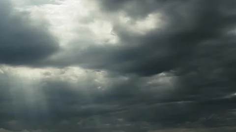 Time lapse moody sky with breaking rays of sun Stock Footage 251018215