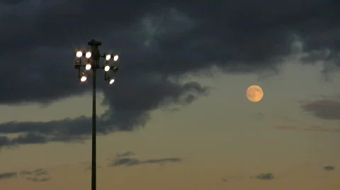 Time lapse moon and clouds over sport field Stock Footage 548910