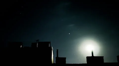 TIME LAPSE Moon and clouds behind house fronts Stock Footage 45550913