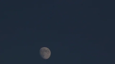 Time lapse of Moon at the bottom of the frame Stock Footage 98744882