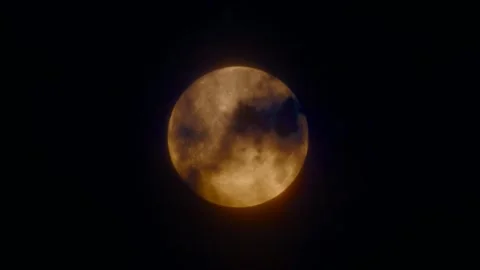 Time-lapse of the moon covered by dark clouds at night during the traditiona Video stock 291003612