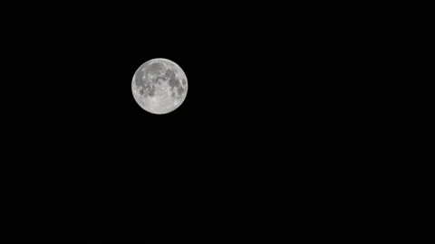 Time lapse: the moon floating in night black sky 4K Stock Footage 131007027