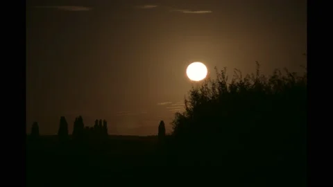 Time Lapse of Moon full going down behind Horizon at Night Video stock 138493592