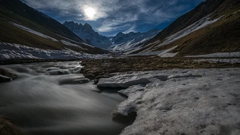 Time-lapse of moon, mountain valley and river. moonrise. snow-capped mountains Video stock 114164195