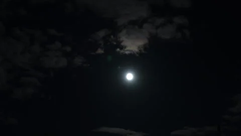Time lapse of moon moves across the cloudy sky at night Stock Footage 304955911