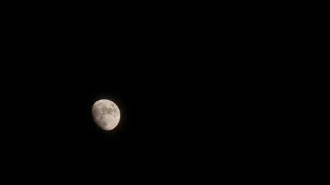 Time lapse of moon at night with a copy space. Half moon with detail surface. Stock Footage 217949692