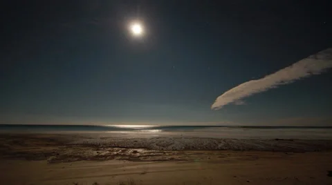 Time lapse of the moon over a beach Stock Footage 24794066