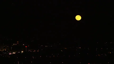 Time Lapse of Moon Over City Stock Footage 34174477