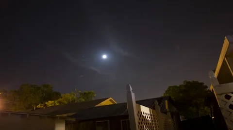 Time lapse of moon over suburban back yard Видео 52526228