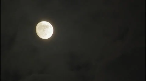 Time lapse of the  moon rising behind the clouds in  Hi Dynamic Range 動画素材 34324528
