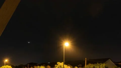 Time-lapse of moonset, lightning during twilight at Sungai Buloh, Selangor Stock Footage 229636921