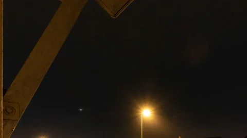 Time-lapse of moonset, lightning during twilight at Sungai Buloh, Selangor Stock Footage 229637688