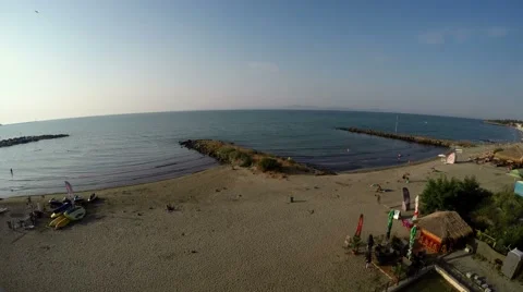 Time lapse of morning beach, people come to the beach, open bars. 4K Stock Footage