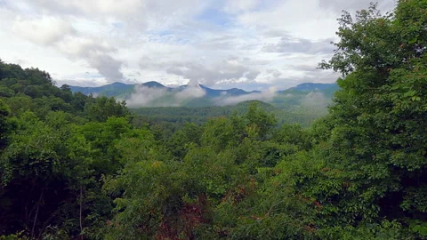 Time-lapse of Morning Clouds Rolling off the Smokey Mountains in Sylva, NC Stock Footage