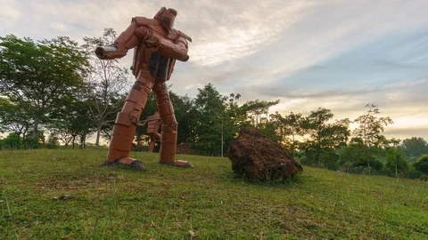 Time lapse on motion slider in front of robotic iron statue by unknown artist 스톡 동영상 97741297