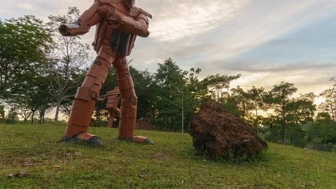 Time lapse on motion slider in front of robotic iron statue by unknown artist Video stock 97741315