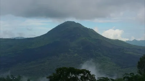 Time-lapse of Mount Batur Volcano with Rain Clouds in Kintamani, Bali Stock Footage 339771475