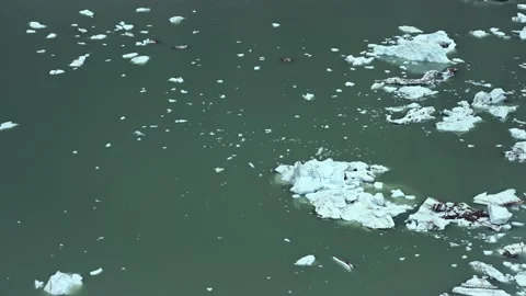 Time lapse of a mountain lake full of pieces of ice that have fallen off a glaci Stock Footage 139662483