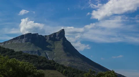 Time lapse of a mountain peak with blue sky Stock Footage 58618796
