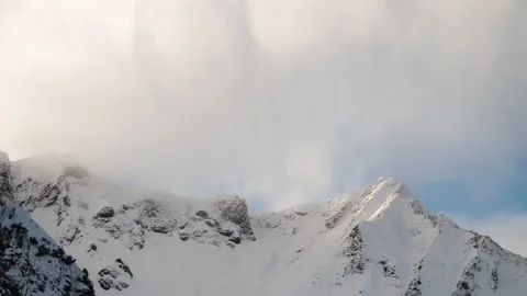 Time Lapse Mountain Range Clouds Snow Cold Austria Alps Switzerland Alpine 4k Video stock 169552372