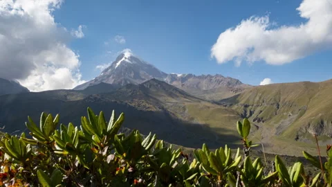Time lapse mountain range with the peak of Mount Kazbek with clouds in nature Stock Footage 292307631