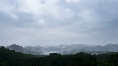 Time lapse mountain range in tropical rainforest with mist, fog and clouds Stock Footage 94118687