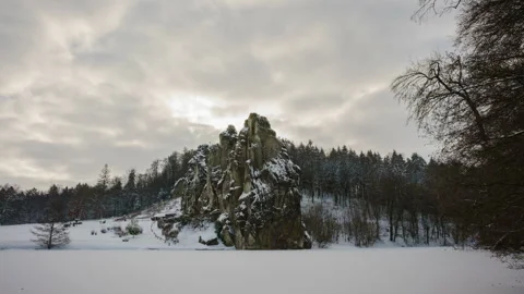 Time lapse of a mountain range in winter. Snow and passing white clouds. Stock Footage 155709388