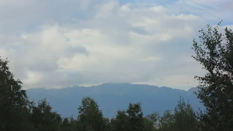 Time-lapse Of A Mountain Surrounded By Clouds Video stock 154668144