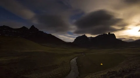 Time lapse of mountain with tent in front Stock Footage 83297817