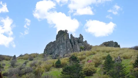 Time Lapse of Mountain Top Lone Strange Rock Meadow Flow Cloud Stock Footage 337942771