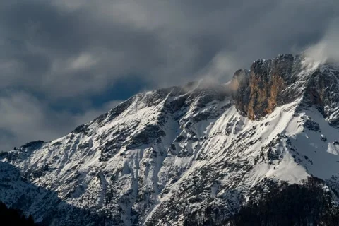 Time lapse Mountain Untersberg in dramatic light winter Stock Footage 138885312