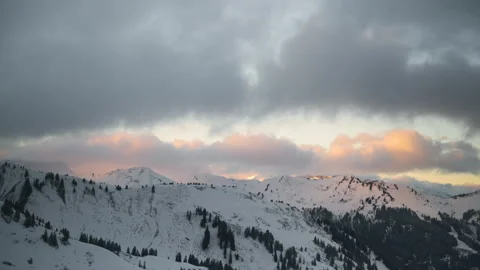 Time-lapse mountains Alps sunset dusk alpenglow winter Video stock 169757635