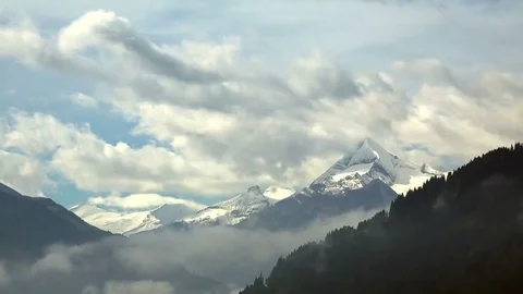 Time Lapse of Mountains with flowing Clouds Stock Footage 69243471