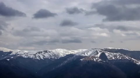 Time Lapse of mountains panorama in winter time with cliffs covered with snow Stock Footage 234081850